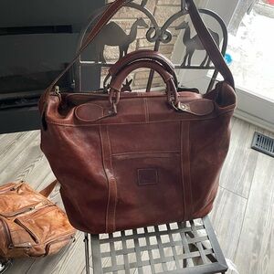 Casillero del Diablo Chile embossed leather weekender/travel tote w/ zip top.